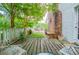 Inviting wooden deck offers outdoor seating and views of the lush backyard at 3545 Liberty Rd, Villa Rica, GA 30180