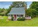 Charming exterior with a bright red front door and well-manicured landscaping at 3545 Liberty Rd, Villa Rica, GA 30180