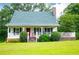 Charming home with a welcoming porch and well-maintained lawn at 3545 Liberty Rd, Villa Rica, GA 30180