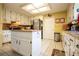 Bright kitchen featuring white cabinets, stainless steel appliances, and a center island at 3545 Liberty Rd, Villa Rica, GA 30180
