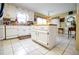 Bright kitchen featuring white cabinets, stainless steel appliances, and a center island at 3545 Liberty Rd, Villa Rica, GA 30180