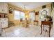 Kitchen featuring a breakfast nook, bright yellow walls, and door to backyard at 3545 Liberty Rd, Villa Rica, GA 30180