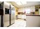 Bright kitchen featuring white cabinets, stainless steel appliances, and a center island at 3545 Liberty Rd, Villa Rica, GA 30180
