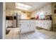 Bright kitchen featuring white cabinets, stainless steel appliances, and a center island at 3545 Liberty Rd, Villa Rica, GA 30180