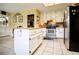 Cozy kitchen with white cabinets, stainless steel appliances, and center island at 3545 Liberty Rd, Villa Rica, GA 30180