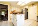 Bright kitchen featuring white cabinets, stainless steel appliances, and a center island at 3545 Liberty Rd, Villa Rica, GA 30180