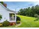 Picture perfect yard with the white railing porch extending to the side at 3545 Liberty Rd, Villa Rica, GA 30180