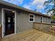 Wood deck connects indoor/outdoor living, perfect for entertaining with wooded view at 4232 Chickasaw Trl, Douglasville, GA 30135