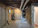 Exposed basement features essential utilities and provides ample unfinished storage space at 4232 Chickasaw Trl, Douglasville, GA 30135