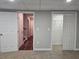 Finished basement with doors provides flexible space for storage or additional living areas at 4232 Chickasaw Trl, Douglasville, GA 30135