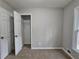Carpeted bedroom with closet and window provides a cozy space for relaxation and rest at 4232 Chickasaw Trl, Douglasville, GA 30135