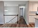 Bright hallway features wood-look floors, modern lighting, and access to multiple rooms in the home at 4232 Chickasaw Trl, Douglasville, GA 30135