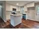 Modern kitchen featuring granite countertops, white cabinets, and stainless steel appliances at 4232 Chickasaw Trl, Douglasville, GA 30135