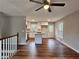 Spacious Living area featuring hardwood floors and a kitchen with white cabinets at 4232 Chickasaw Trl, Douglasville, GA 30135