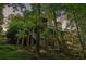 Private backyard with multiple decks and lush trees, creating a peaceful and serene setting for outdoor enjoyment at 8355 Ainsworth Dr, Cumming, GA 30041