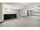Finished basement with a bar area, carpet, and recessed lighting at 8355 Ainsworth Dr, Cumming, GA 30041