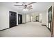 A finished basement offers multiple rooms, carpet, and black trim at 8355 Ainsworth Dr, Cumming, GA 30041