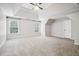 Expansive main bedroom with trey ceiling, recessed lighting, and plush carpeting at 8355 Ainsworth Dr, Cumming, GA 30041