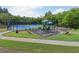 Well-maintained community playground and tennis court offering recreation for residents in a lush, green environment at 8355 Ainsworth Dr, Cumming, GA 30041
