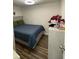 Cozy bedroom with a comfortable bed, hardwood floors, and ample natural light at 120 Valley Dr, Loganville, GA 30052