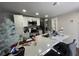 Modern kitchen with stainless steel appliances and a bright breakfast bar, perfect for entertaining at 120 Valley Dr, Loganville, GA 30052