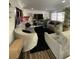 Bright living room featuring sleek furniture, wood floors, and great natural light at 120 Valley Dr, Loganville, GA 30052