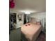 Bedroom featuring a comfortable bed, custom closet, and soft natural lighting at 120 Valley Dr, Loganville, GA 30052