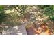 An elevated view of the backyard deck and large trees at 159 Forest Ave, Social Circle, GA 30025