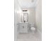 Bathroom featuring white vanity, modern mirror and fixtures, and tiled floor at 159 Forest Ave, Social Circle, GA 30025