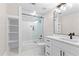 Bathroom featuring a shower/tub, white vanity and shelving at 159 Forest Ave, Social Circle, GA 30025