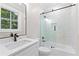 Bathroom featuring a sliding glass shower door and a white vanity with modern fixtures at 159 Forest Ave, Social Circle, GA 30025