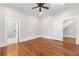 Bedroom featuring hardwood floors, ceiling fan, and natural light at 159 Forest Ave, Social Circle, GA 30025