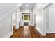 Hallway view to covered porch, hardwood flooring and white trim at 159 Forest Ave, Social Circle, GA 30025