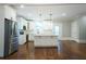 Modern kitchen featuring stainless steel appliances and a large island at 159 Forest Ave, Social Circle, GA 30025