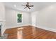 Bright living room featuring hardwood floors and ceiling fan at 159 Forest Ave, Social Circle, GA 30025