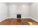 Living room featuring hardwood floors, fireplace and crown molding at 159 Forest Ave, Social Circle, GA 30025