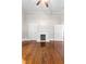 Spacious living room with hardwood floors, fireplace, and ceiling fan at 159 Forest Ave, Social Circle, GA 30025