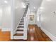 Bright staircase with hardwood floors at 159 Forest Ave, Social Circle, GA 30025