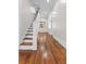 Bright staircase with hardwood floors at 159 Forest Ave, Social Circle, GA 30025