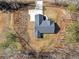 Overhead view of the home, showcasing the roof, driveway, and surrounding lot at 1847 Davis Mill Rd, Dallas, GA 30157