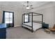 Bright bedroom features neutral colors, a tray ceiling, and a four-poster bed frame at 1847 Davis Mill Rd, Dallas, GA 30157