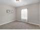 Bedroom with carpet, a light, and a window at 1847 Davis Mill Rd, Dallas, GA 30157