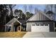 Single-story house featuring a two-car garage, gray siding, and a front yard at 1847 Davis Mill Rd, Dallas, GA 30157