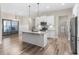 Modern kitchen featuring stainless steel appliances, granite countertops, and an island with a sink at 1847 Davis Mill Rd, Dallas, GA 30157