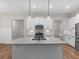 Bright kitchen with stainless steel appliances, white cabinets, granite countertops, and a kitchen island at 1847 Davis Mill Rd, Dallas, GA 30157