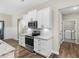Modern kitchen featuring white cabinets, stainless steel appliances, and granite countertops at 1847 Davis Mill Rd, Dallas, GA 30157