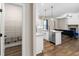A modern kitchen with granite countertops, stainless steel appliances and dark hardwood floors at 1847 Davis Mill Rd, Dallas, GA 30157