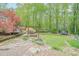 Secluded backyard with lush greenery, mature trees, and plenty of space for outdoor activities at 2101 Kinridge Rd, Marietta, GA 30062