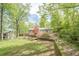 Beautiful backyard with lush greenery, a well-manicured lawn, and plenty of shade trees at 2101 Kinridge Rd, Marietta, GA 30062