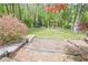 Lush backyard with a trampoline, flowering trees, and a garden plot, creating a serene outdoor space at 2101 Kinridge Rd, Marietta, GA 30062